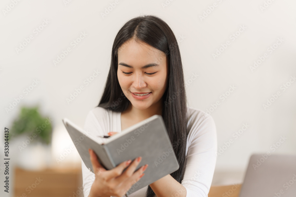 Happy smart asian woman freelancer working with laptop while live in the room. Happy smart asian woman freelancer working with laptop while live in the room.