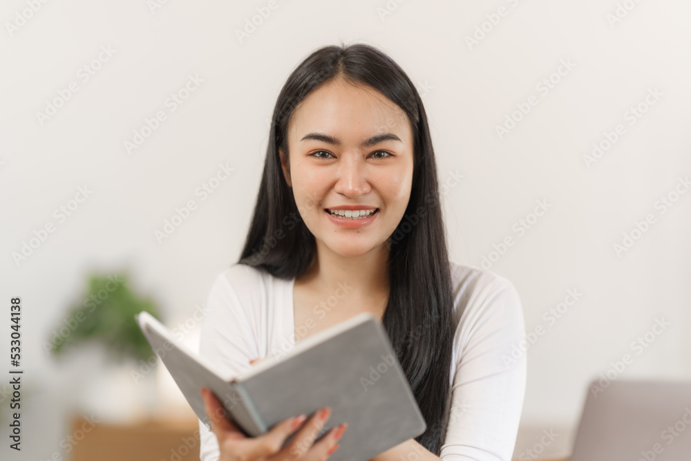 Happy smart asian woman freelancer working with laptop while live in the room. Happy smart asian woman freelancer working with laptop while live in the room.