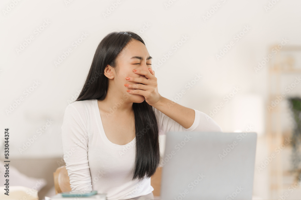 Young asian business woman freelancer tired at work on christmas time. Young asian business woman freelancer tired at work on christmas time.