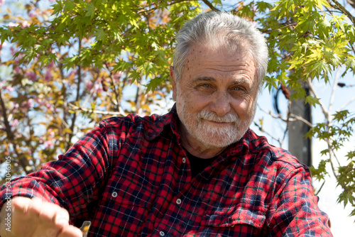 Joyful expression at good looking elderly man having smiley face 