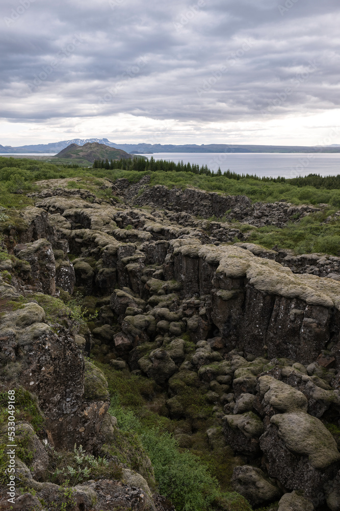 Rift in lava rock formations near Thingvellir National Park in Iceland Rift in lava rock formations near Thingvellir National Park in Iceland