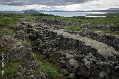 Rift in lava rock formations near Thingvellir National Park in Iceland