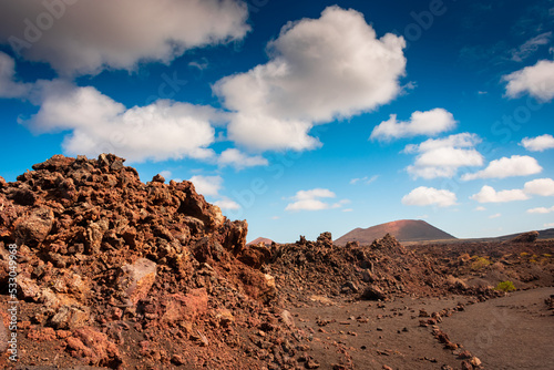 Wild volcanic landscape of Los Volcanes Natural Park in Lanzarote, Canary Islands, Spain