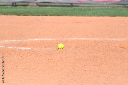 Softball on the Infield of a Softball Field © Steve