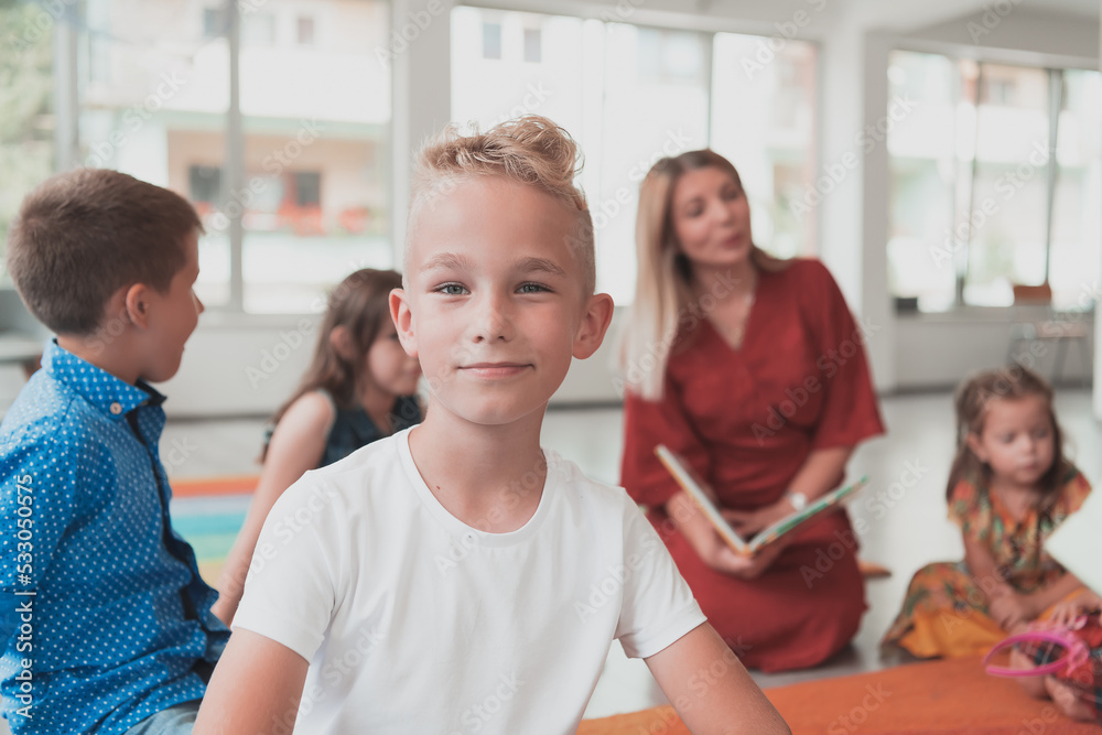 Portrait photo of a smiling boy in a preschool institution having fun Portrait photo of a smiling boy in a preschool institution having fun