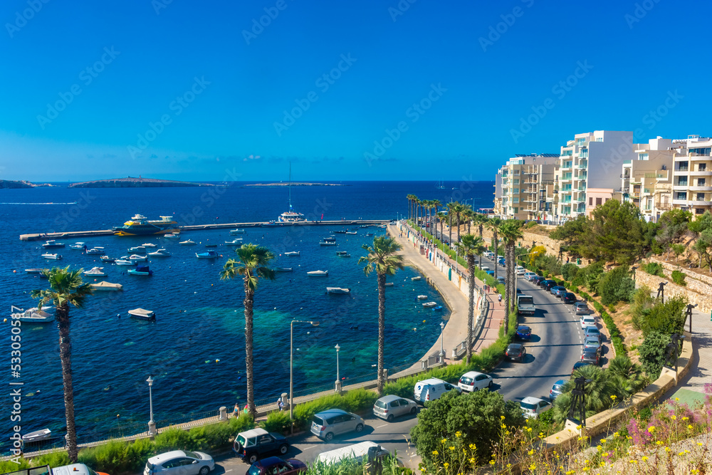 Bugibba, Malta, 22 May 2022:  View of the harbor and the promenade - obrazy, fototapety, plakaty 