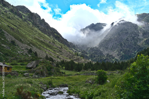 Mountain Landcape in Andorra during spring season : water flowing down in a valley © João Kermadec