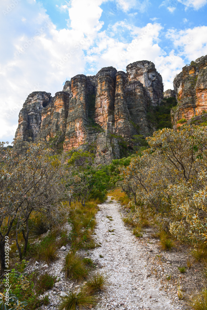 A hiking trail among the rugged cliffs and rich Cerrado vegetation on the way to the Cânion do Funil canyon, Presidente Kubitschek, Minas Gerais state, Brazil