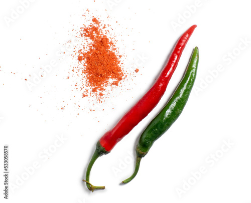 The green pepper and ground red pepper are isolated. Spicy pepper on a white background. Ingredient for a burning dish.