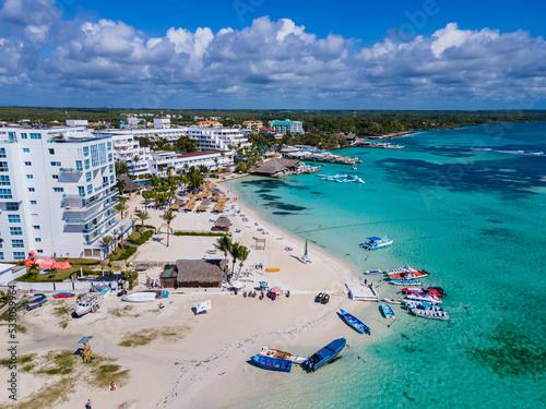 Bild auf Leinwand Beautiful aerial view of Boca Chica beach, its turquoise waters, resorts near th