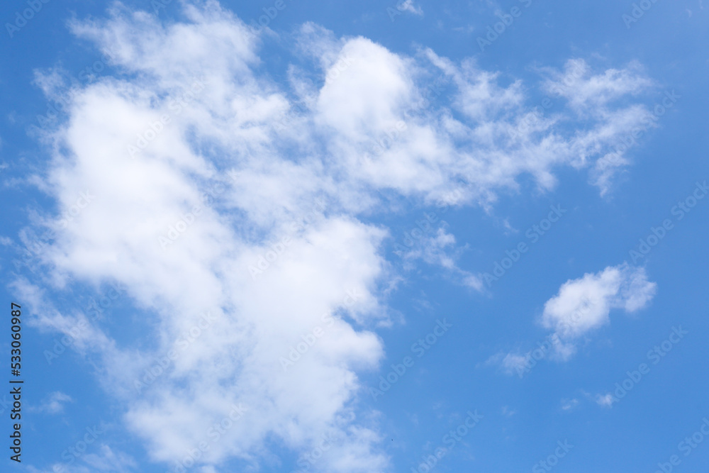 Beautiful blue sky with fluffy clouds, low angle view Beautiful blue sky with fluffy clouds, low angle view
