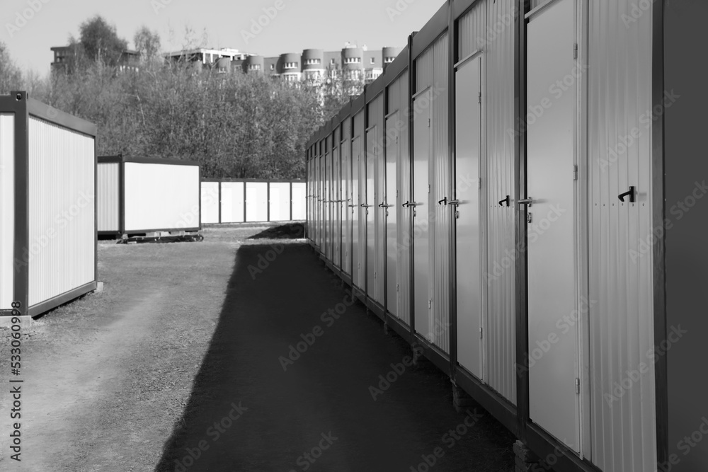 New modular houses for internally displaced persons outdoors. Black and white effect