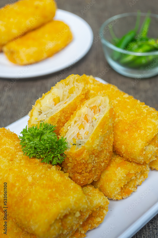 Risoles bihun or rissole with vermicelli noodle filling served on white plate. snacks that are cooked by frying, have a savory taste Risoles bihun or rissole with vermicelli noodle filling served on white plate. snacks that are cooked by frying, have a savory taste