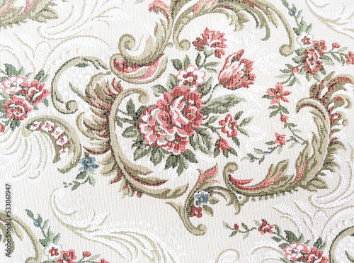 Fragment of colorful retro tapestry textile pattern with floral ornament useful as background