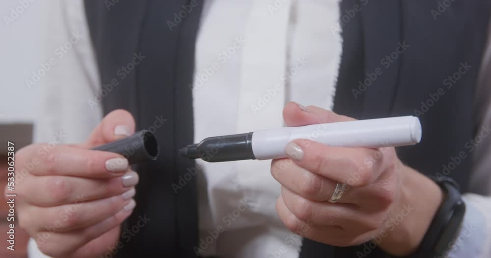 Female hands nervously open, close marker. Woman in formal clothes is worried before important meeting, fiddling with felt-tip pen hands. Coach calms himself down hand movements before public speaking Female hands nervously open, close marker. Woman in formal clothes is worried before important meeting, fiddling with felt-tip pen hands. Coach calms himself down hand movements before public speaking