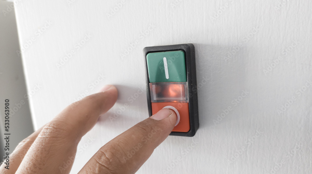 Finger Operated Button Foto de The Finger touch on the button on machine control panel.Push ...