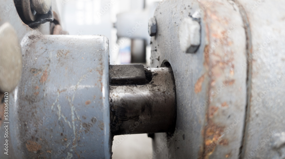 The old pulley wheel with the key slot isolated on a coupler driven pump.