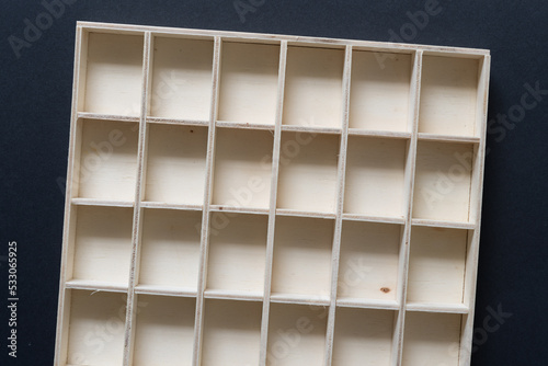 empty wooden box with squares viewed from top 