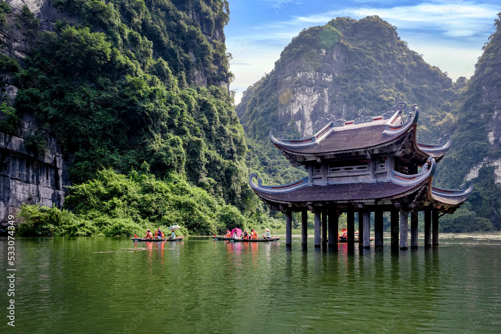 The Ancient Pagoda Is Located On The River In Trang An Ninh Binh 
