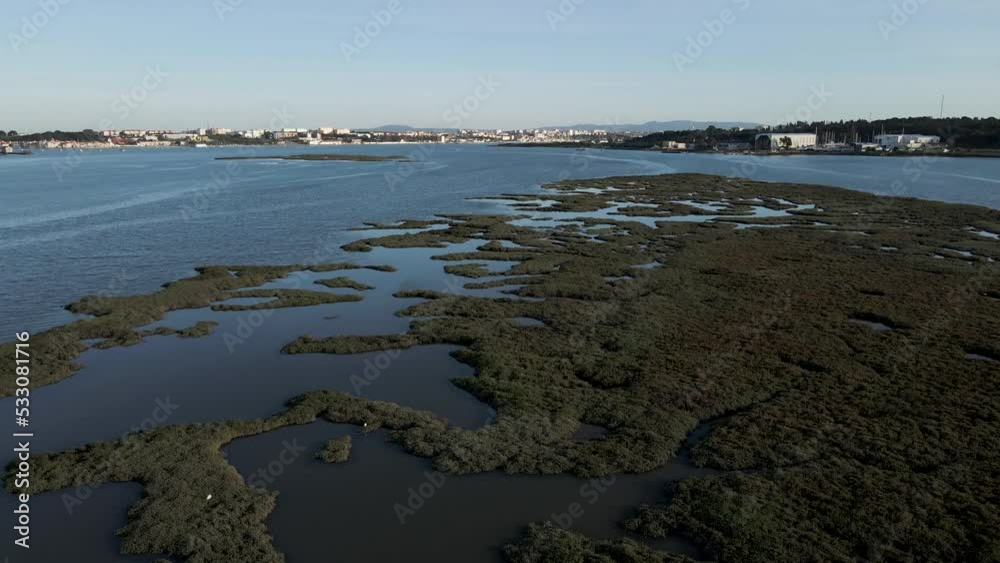 Aerial view of abstract pattern from a lagoon along the Tagus river in Corroios, Setubal, Portugal.