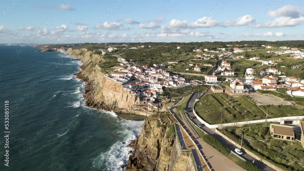 Aerial view of Azenhas do Mar, a small township along the wild Portuguese coastline facing the Atlantic Ocean, Colares, Portugal. Aerial view of Azenhas do Mar, a small township along the wild Portuguese coastline facing the Atlantic Ocean, Colares, Portugal.