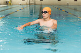 Swimming - male swimmer, man in indoor pool