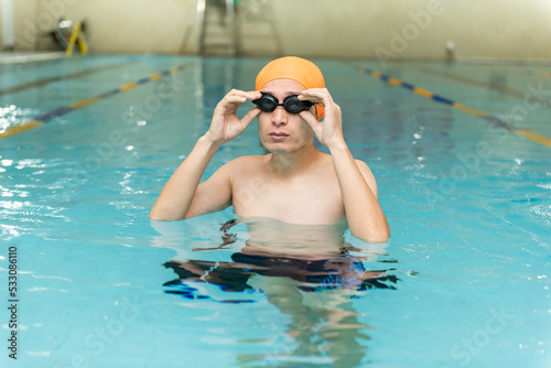 Swimming - male swimmer, man in indoor pool