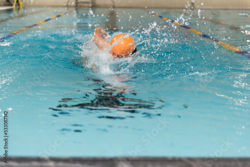 Swimming - male swimmer, man in indoor pool