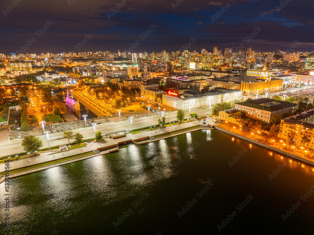 Fototapeta premium Embankment of the central pond and Plotinka in Yekaterinburg at summer or early autumn night. The historic center of the city of Yekaterinburg, Russia, Aerial View