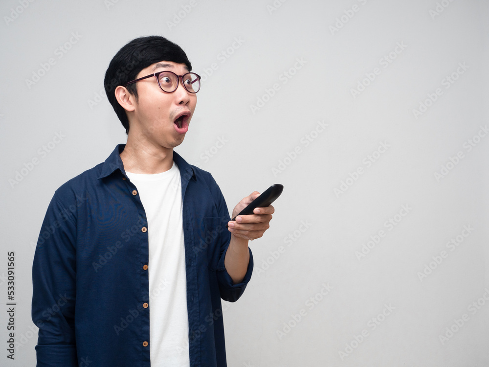 Positive man feels amazed gesture press remote tv isolated Positive man feels amazed gesture press remote tv isolated