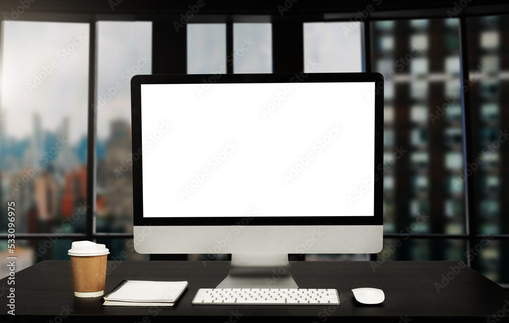 Workspace computer putting on wood working desk and surrounded by coffee cup, clipboard, potted plant, stack of smartphone, tablet, and keyboard Orderly office Workspace computer putting on wood working desk and surrounded by coffee cup, clipboard, potted plant, stack of smartphone, tablet, and keyboard Orderly office