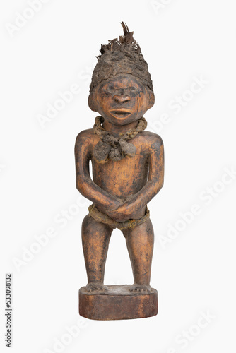 Figurine of an African Child. Woden Sculpture on a white background. photo