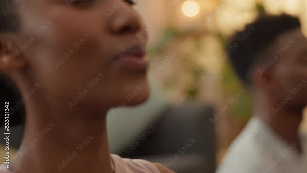 Black couple, bond or meditation breathing in mental health, chakra energy or mind training in living room or house interior. Zen yoga, peace or relax man and woman in holistic lotus fitness wellness