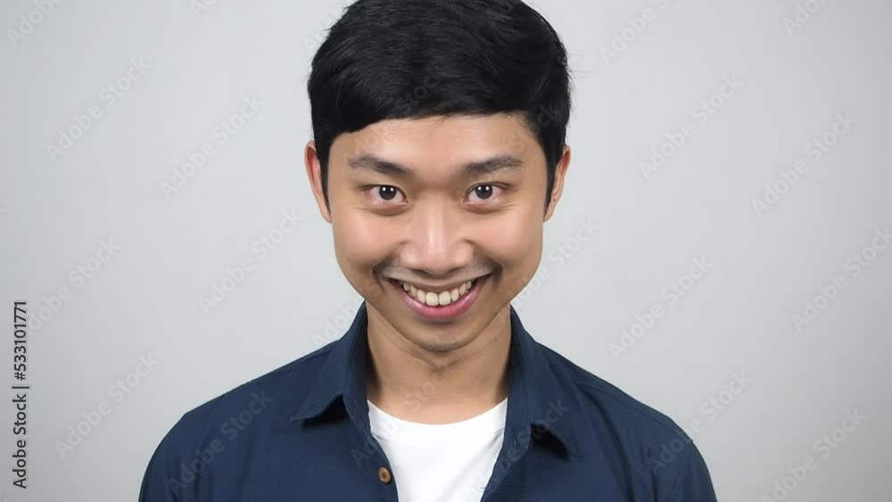 Close up man look up to smiling and looking at camera Close up man look up to smiling and looking at camera