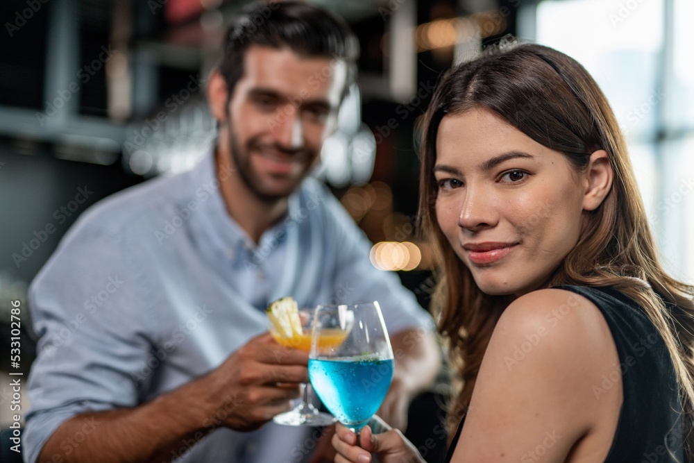 Portrait photo of a couple having a good time together drinking cocktail in a sky lounge and bar in Bangkok city Portrait photo of a couple having a good time together drinking cocktail in a sky lounge and bar in Bangkok city