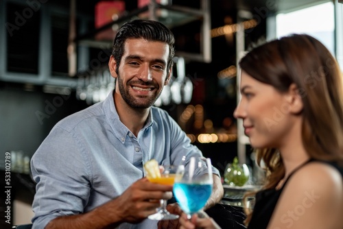 Photography Portrait photo of a couple having a good time together drinking cocktail in a sk
