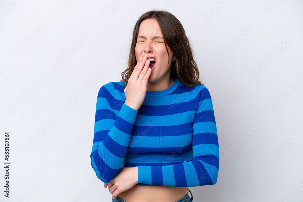 Young caucasian woman isolated on white background yawning and covering wide open mouth with hand Young caucasian woman isolated on white background yawning and covering wide open mouth with hand