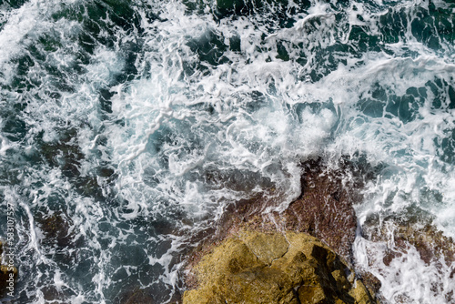 waves crashing on the rocky coastline