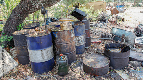 waste engine oil kept in tank behind factory