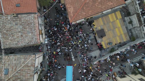 Aerial view of people in the street of Ospedaletto d'Alpinolo during A Juta a Montevergine, a traditional folk festival in Avellino, Irpinia, Italy. photo