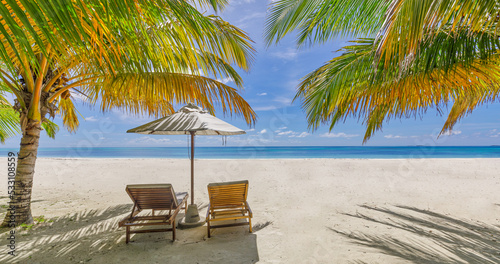 Amazing vacation beach. Couple chairs together by the sea banner. Summer romantic holiday honeymoon concept. Tropical island landscape. Tranquil shore panorama, relax sand seaside horizon, palm leaves