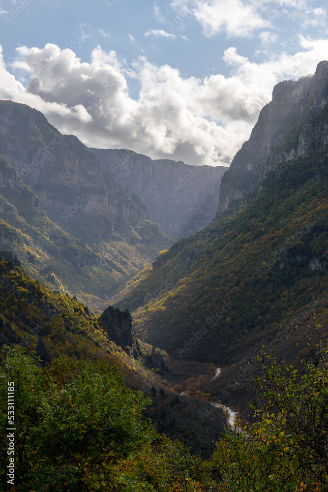 Fototapeta premium view of Vikos Gorge, the deepest gorge in Europe, with fall colors near vikos village in Zagori Epirus, Greece.