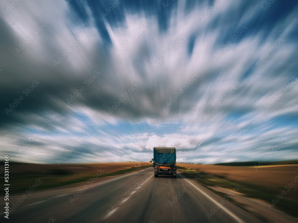 Truck is driving on an empty highway Truck is driving on an empty highway