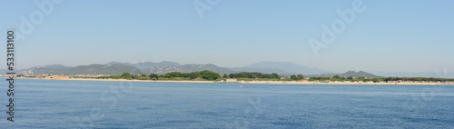 View from the sea towards Tordera River delta, Catalonia, Spain. photo