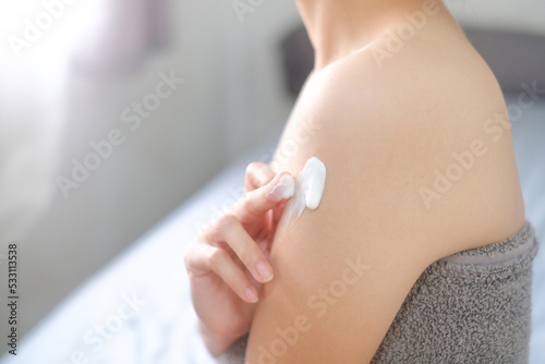 Asia woman applying natural cream, Woman moisturizing her arm with cosmetic cream, Spa and Manicure concept.