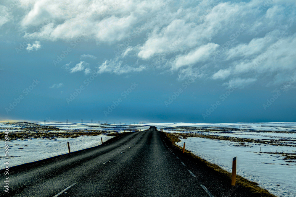 Winter landscape road with snow and clouds in Iceland