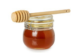 jar of honey with dipper isolated