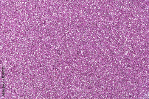 Glitter background in your admirable lilac tone as part of your creative work. Elegant texture for Christmas design. Holiday abstract glitter with blinking lights. Christmas, xmas abstract texture.