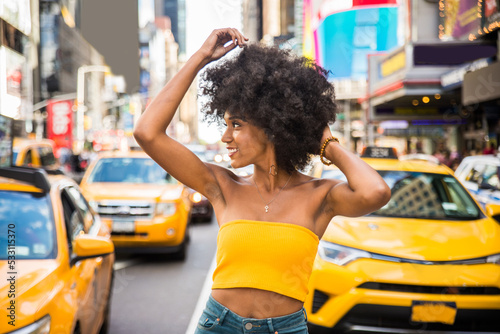 Beautiful afro-american woman walking in New York - Young black female adult tourist in Manhattan, USA