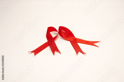 World aids day, red silk ribbon symbol of AIDS Awarenesss photo